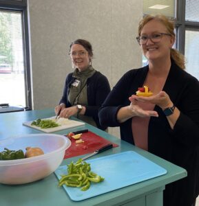 staff preparing peppers