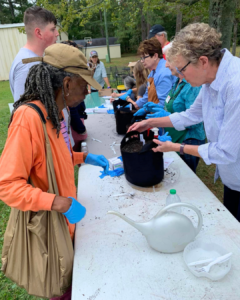 Bucket Brigade Image from previous event. Features attendees and grow buckets!