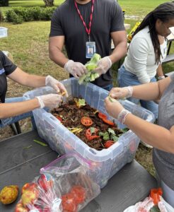 Staff making compost